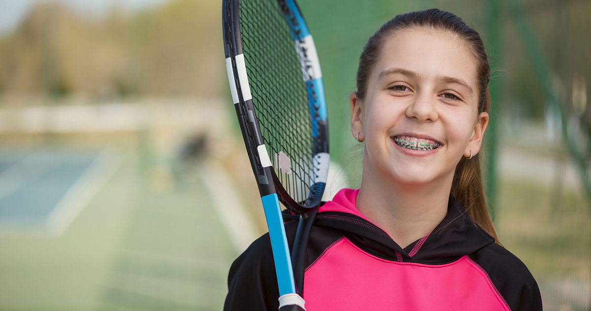 Young Girl With Braces Posing NHS vs private braces for children